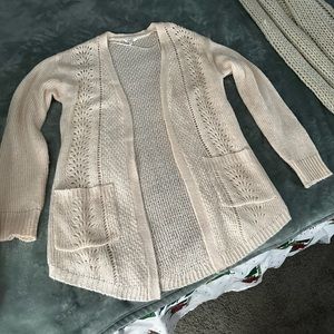 a very light pink cardigan from Candie’s!